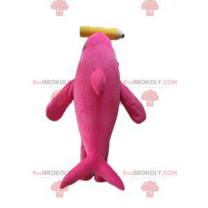 Mascotte balena assassina delfino rosa e bianca con una matita
