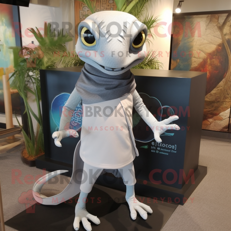 Gray geckos mascot costume character dressed with Polo Tee and Shawl pins Gray geckos mascot costume character dressed with Polo Tee and Shawl pins