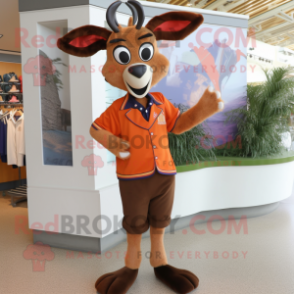 Rust Gazelle mascot costume character dressed with Cardigan and Shoe clips