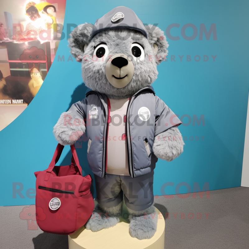 Gray Raspberry mascot costume character dressed with Bomber Jacket and Tote bags