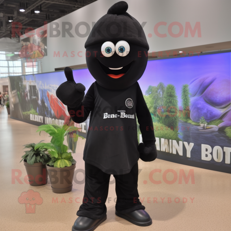 Black Eggplant mascot costume character dressed with Jeans and Berets Black Eggplant mascot costume character dressed with Jeans and Berets