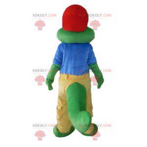 Mascote crocodilo verde vestido de amarelo e azul -