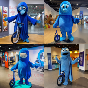 Blue Unicyclist mascot costume character dressed with a Hoodie and Shawls