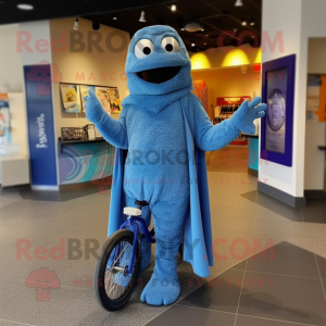 Blue Unicyclist mascot costume character dressed with a Hoodie and Shawls