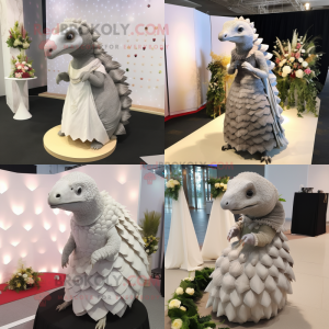 Gray Pangolin mascot costume character dressed with a Wedding Dress and Earrings