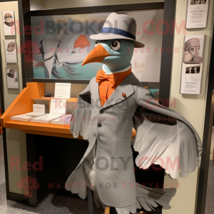 Gray Passenger Pigeon mascot costume character dressed with a T-Shirt and Pocket squares