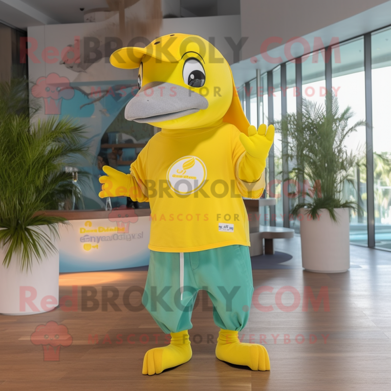 Lemon Yellow Dolphin mascot costume character dressed with a Graphic Tee and Berets