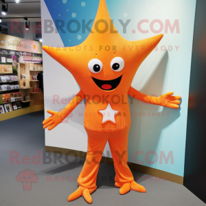 Orange Starfish mascot costume character dressed with a Long Sleeve Tee and Lapel pins