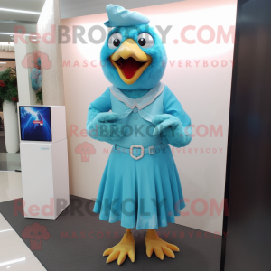 Turquoise Chicken mascot costume character dressed with a Wrap Dress and Tie pins