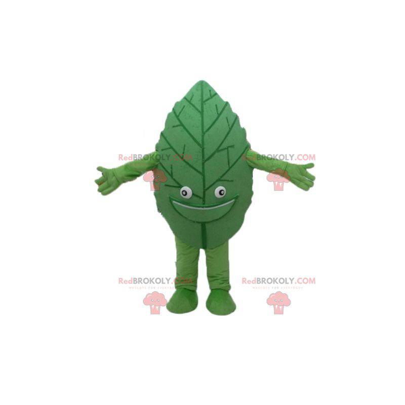 Gigantyczna i uśmiechnięta maskotka z zielonych liści -