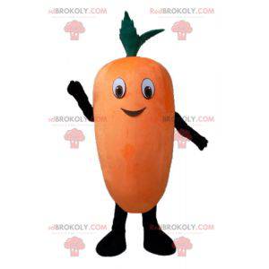 Mascotte arancione gigante e sorridente della carota -