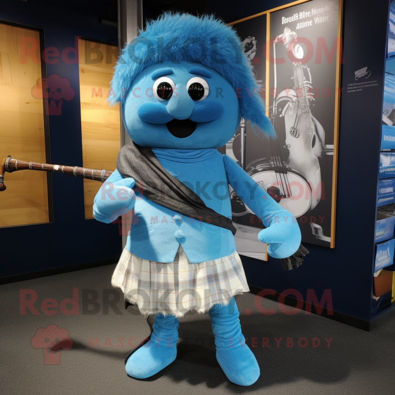 Sky Blue Bagpipe mascot costume character dressed with a Jeans and Shawl pins