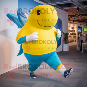 Yellow Blue Whale mascot costume character dressed with a Running Shorts and Cufflinks
