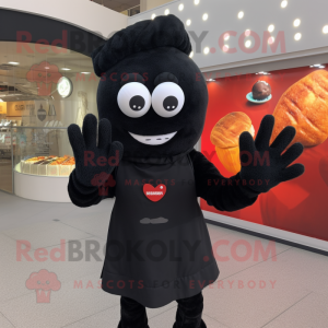 Black Shakshuka mascot costume character dressed with a Sweater and Gloves