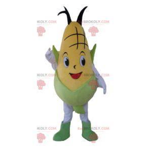 Mascota de mazorca de maíz amarillo y verde gigante y sonriente