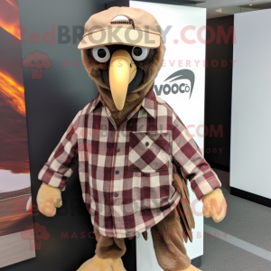Brown Vulture mascot costume character dressed with a Flannel Shirt and Hat pins