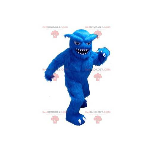 Mascote do yeti todo peludo e azul com dentes grandes -