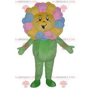 Mooie reusachtige mascotte en lachende veelkleurige bloem -