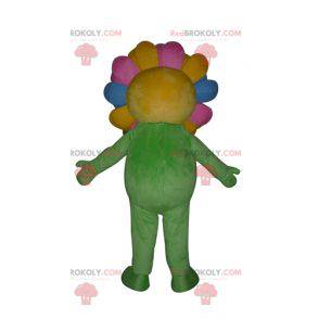 Mascot pretty giant and smiling multicolored flower -