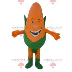 Mascota gigante de mazorcas de maíz naranja y verde sonriendo -