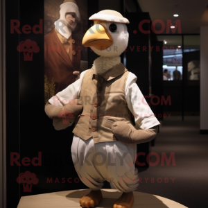 Tan Pigeon mascot costume character dressed with a Vest and Cummerbunds