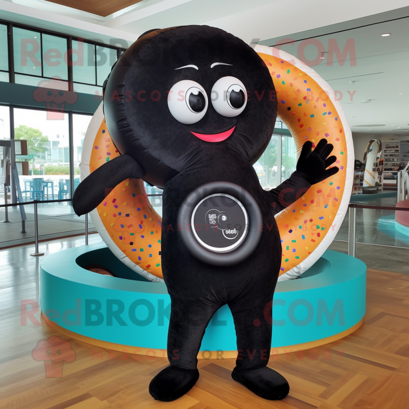 Black Donut mascot costume character dressed with a Bikini and Rings