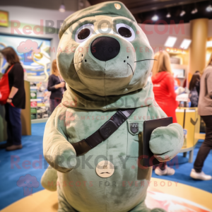 Olive Seal mascot costume character dressed with a Overalls and Rings