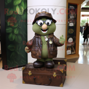 Olive Treasure Chest mascot costume character dressed with a Leather Jacket and Reading glasses