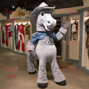 Gray Horseshoe mascot costume character dressed with a Long Sleeve Tee and Suspenders