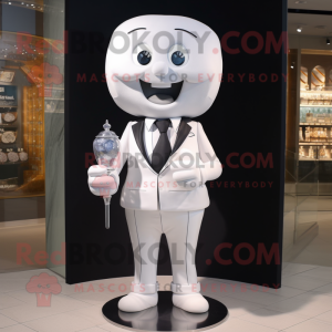 White Hourglass mascot costume character dressed with a Blazer and Clutch bags