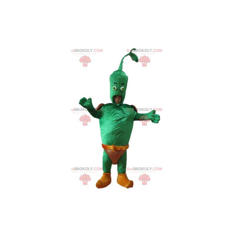 Gigantyczna zielona warzywna maskotka z brązową halką -