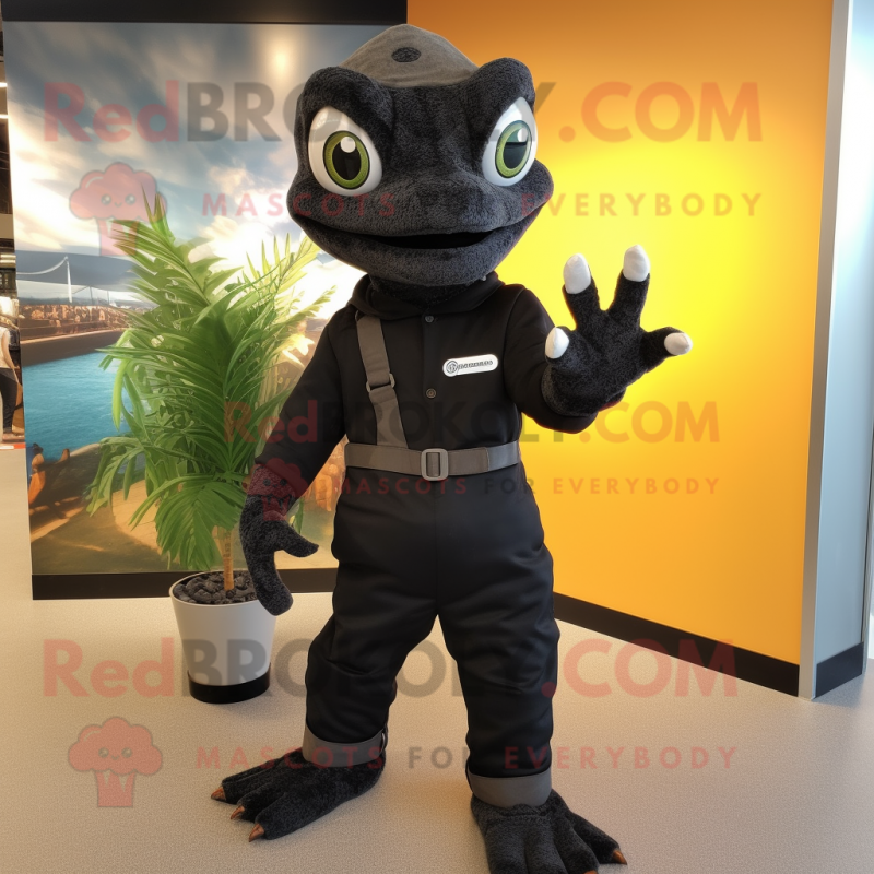 Black Geckos mascot costume character dressed with a Overalls and Gloves