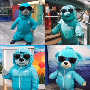 Turquoise Stellar'S Sea Cow mascot costume character dressed with a Windbreaker and Sunglasses