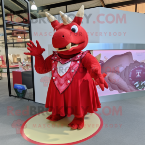 Red Triceratops mascot costume character dressed with a Maxi Dress and Rings