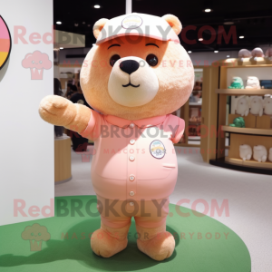 Peach Bear mascot costume character dressed with a Polo Tee and Keychains