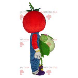 Sorridente mascotte pomodoro rosso con un cavolfiore -