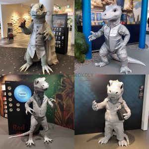 Silver Komodo Dragon mascot costume character dressed with a Chinos and Coin purses