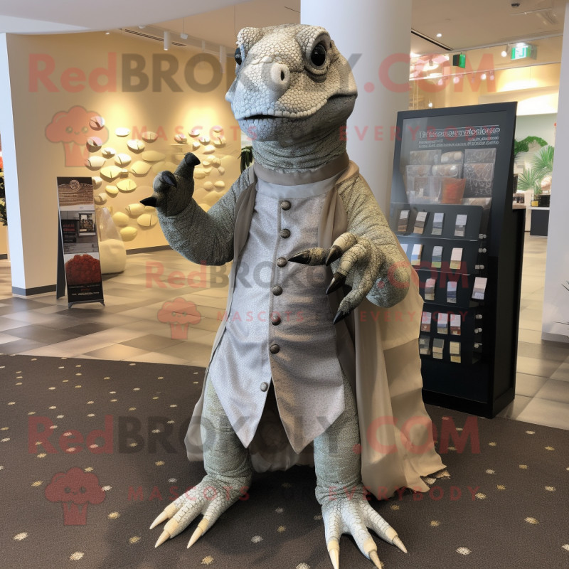 Silver Komodo Dragon mascot costume character dressed with a Chinos and Coin purses Silver Komodo Dragon mascot costume character dressed with a Chinos and Coin purses
