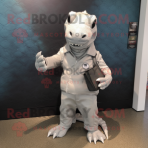 Silver Komodo Dragon mascot costume character dressed with a Chinos and Coin purses