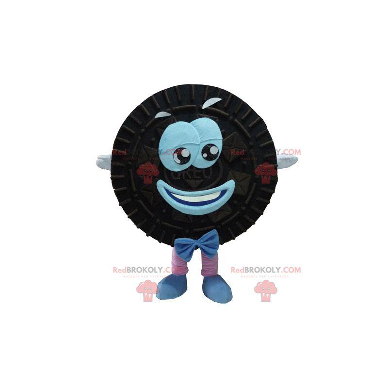 Mascot Oreo zwarte en blauwe cake rond en glimlachend -