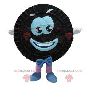 Mascot Oreo zwarte en blauwe cake rond en glimlachend -