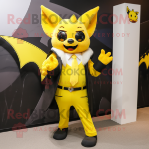 Yellow Bat mascot costume character dressed with a Blazer and Earrings