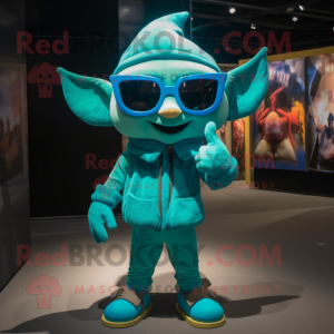 Turquoise Elf mascot costume character dressed with a Jumpsuit and Sunglasses