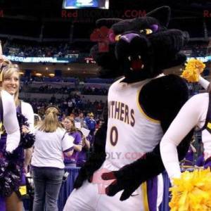 Mascotte gatto nero e viola in abbigliamento sportivo -
