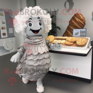 Silver Croissant mascot costume character dressed with a Cardigan and Hair clips