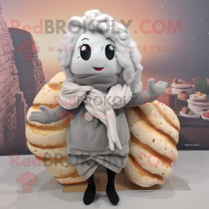 Silver Croissant mascot costume character dressed with a Cardigan and Hair clips