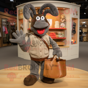 Gray Lobster Bisque mascot costume character dressed with a Corduroy Pants and Tote bags