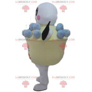 Mascotte d'oiseau blanc et noir dans un pot de crème glacée -