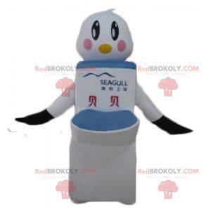 Mascot pájaro blanco y negro con inodoros gigantes -