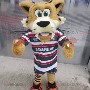 Mascote de tigre bege e amarelo em roupas esportivas -